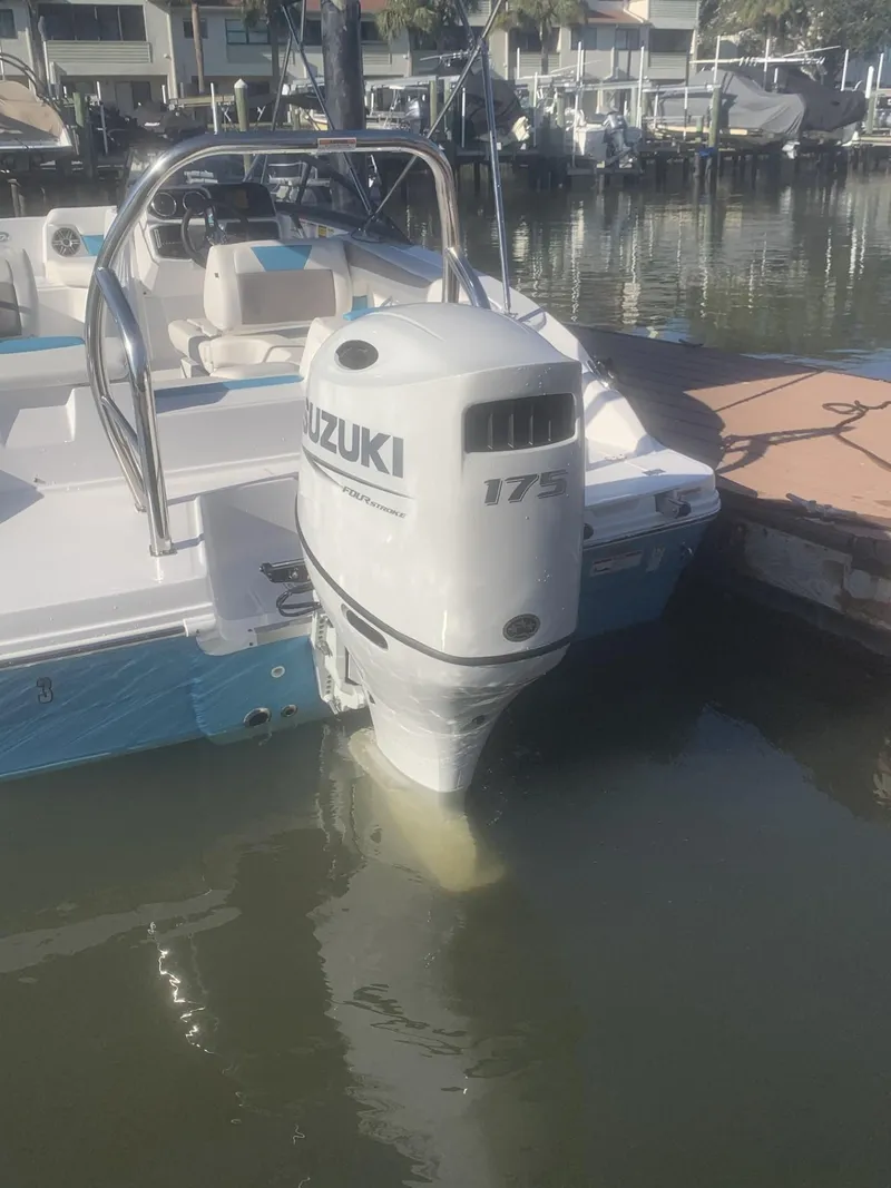 Slide: The Image of Boat with Suzuki 175 outboard motor, docked; Hurricane SD 2050, 2025 model. - 10