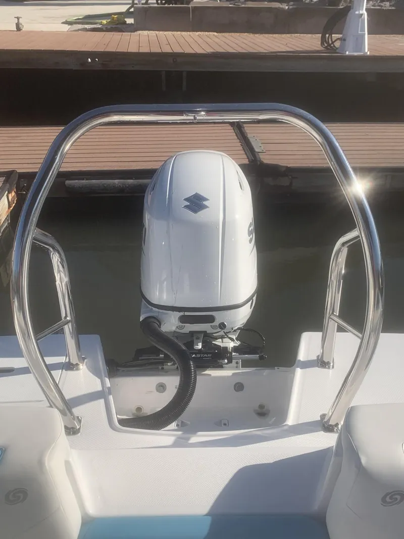 Slide: The Image of 2025 Hurricane SD 2050 boat with outboard motor at dock. - 12