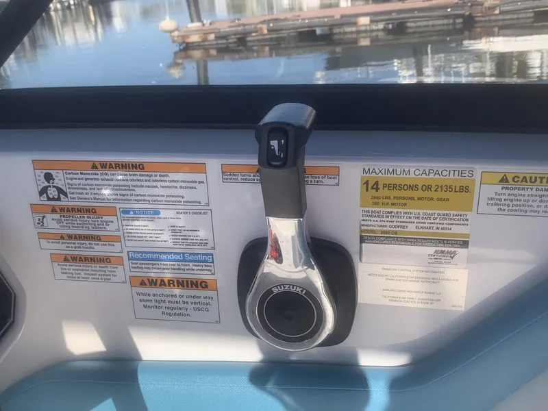 Slide: The Image of Boat control panel with warnings and capacity details, Hurricane SD 2050, 2025 model. - 21