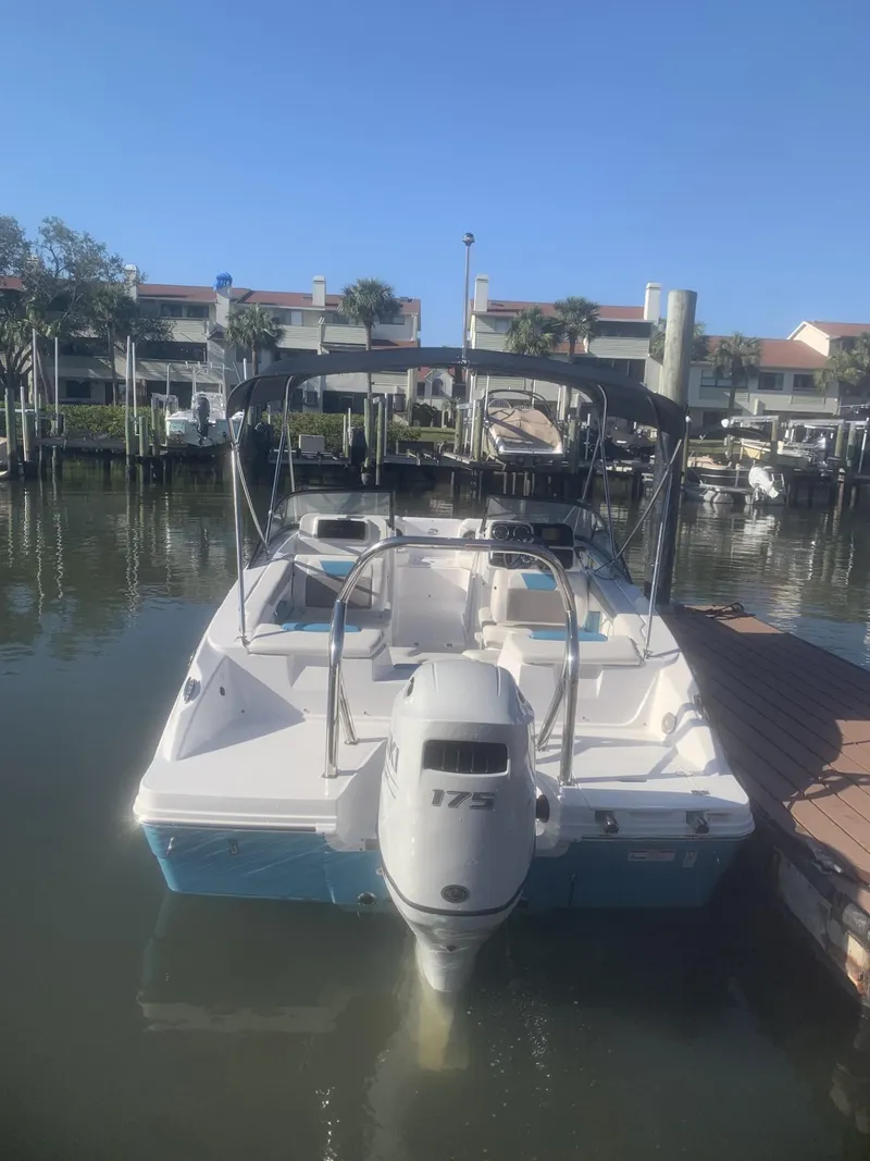 Slide: The Image of 2025 Hurricane SD 2050 boat docked in a serene marina setting. - 3