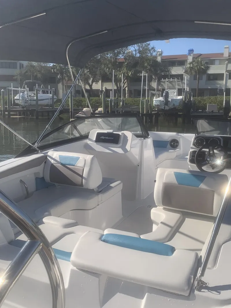 Slide: The Image of 2025 Hurricane SD 2050 boat interior with modern seating and steering wheel. - 7
