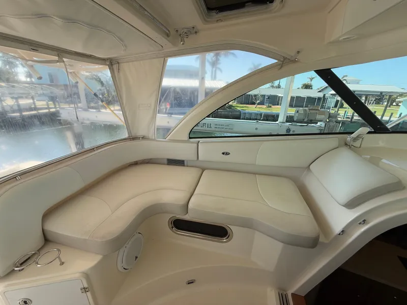 Slide: The Image of Control panel of a 2011 Pursuit OS 345 Offshore boat with various switches and dials. - 10