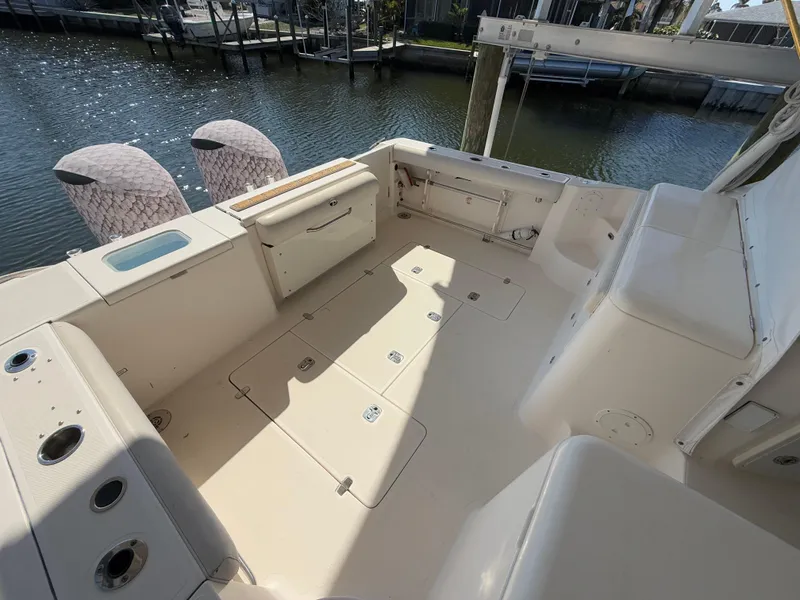 Slide: The Image of Interior of 2011 Pursuit OS 345 Offshore boat with shower and light fixture. - 24