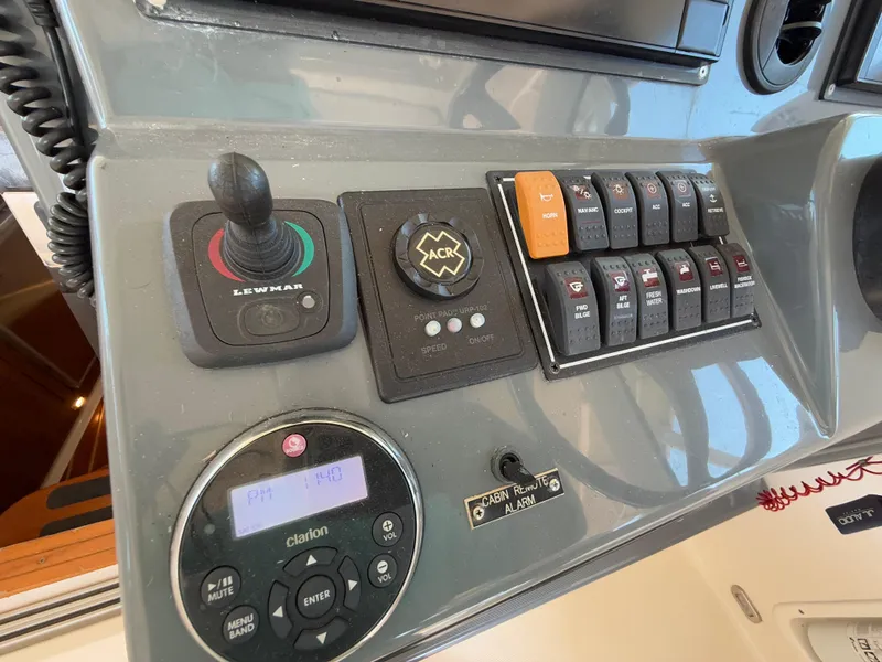 Slide: The Image of 2011 Pursuit OS 345 Offshore boat interior with kitchenette and sink. - 7