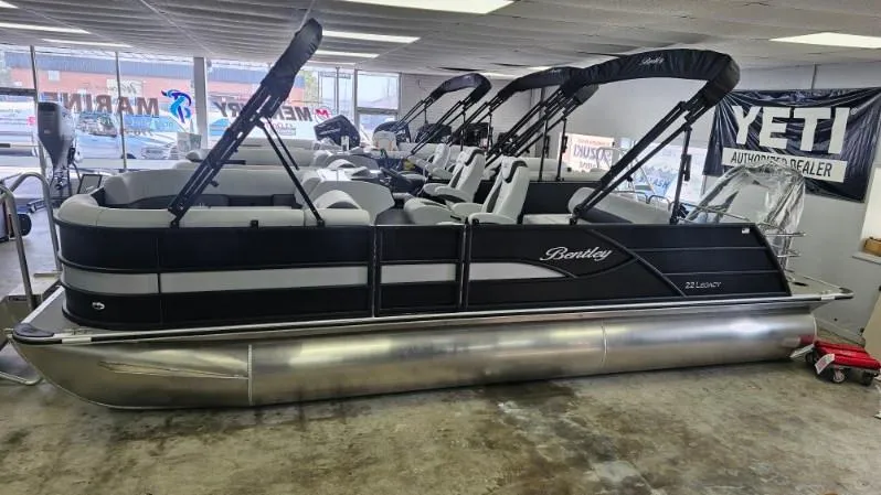 Slide: The Image of 2025 Bentley Pontoons Legacy 223 Swingback displayed in showroom. - 0