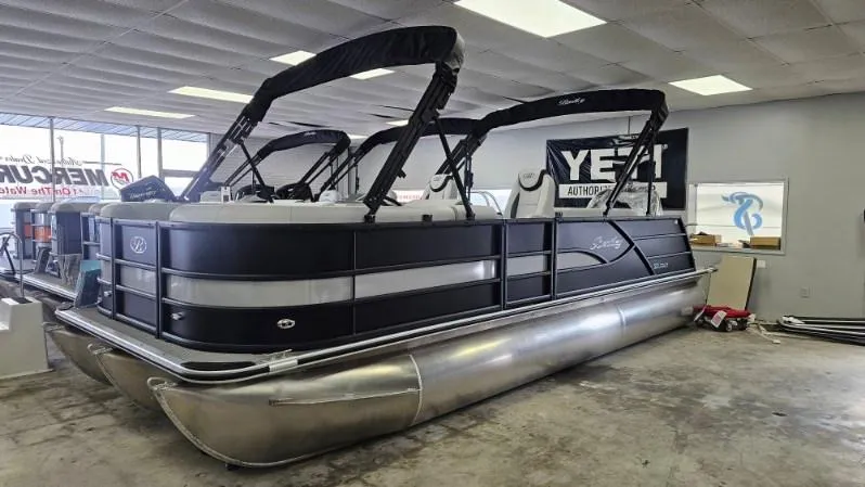Slide: The Image of 2025 Bentley Pontoons Legacy 223 Swingback in showroom, featuring sleek design and modern amenities. - 1