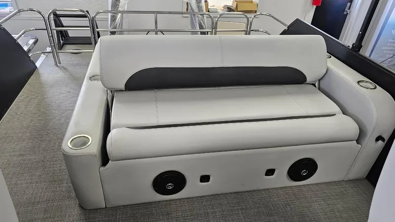 Slide: The Image of 2025 Bentley Pontoons Legacy 223 Swingback interior seating with cup holders and speakers. - 10