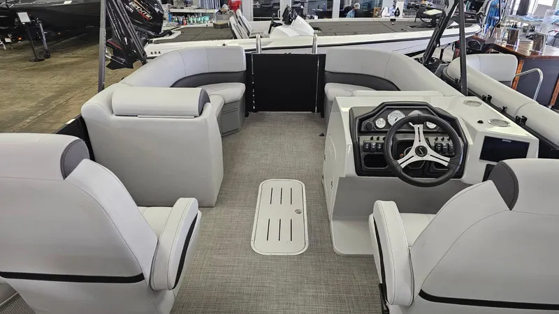 Slide: The Image of 2025 Bentley Pontoons Legacy 223 Swingback interior with modern seating and steering console. - 12