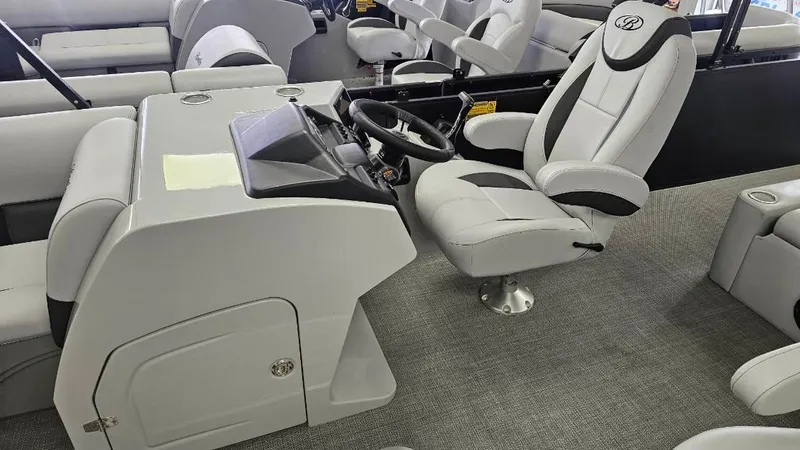 Slide: The Image of 2025 Bentley Pontoons Legacy 223 Swingback interior with modern helm and seating. - 4