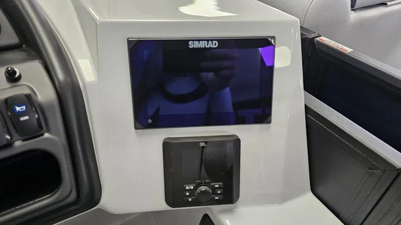 Slide: The Image of Control panel of 2025 Bentley Pontoons Legacy 223 Swingback with Simrad display. - 6