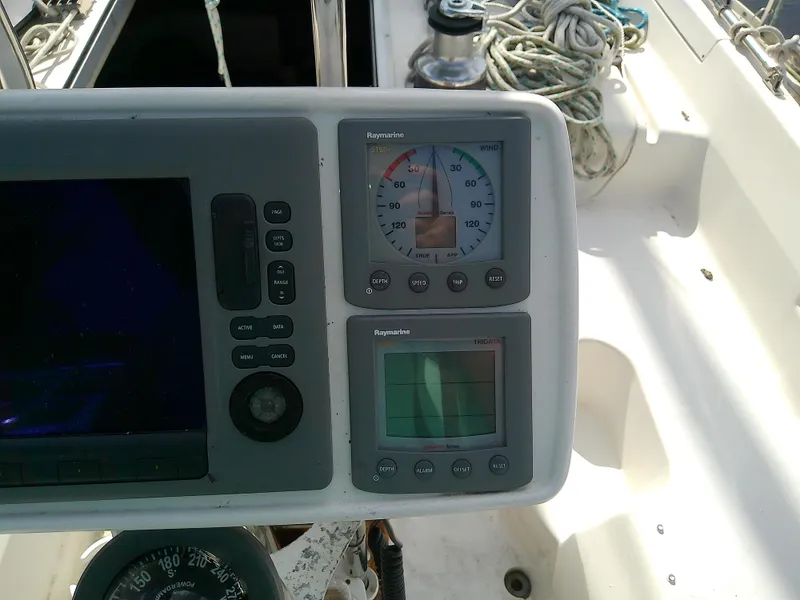 Slide: The Image of Control panel of a 1990 Hunter Passage 42 sailboat with navigation instruments. - 17