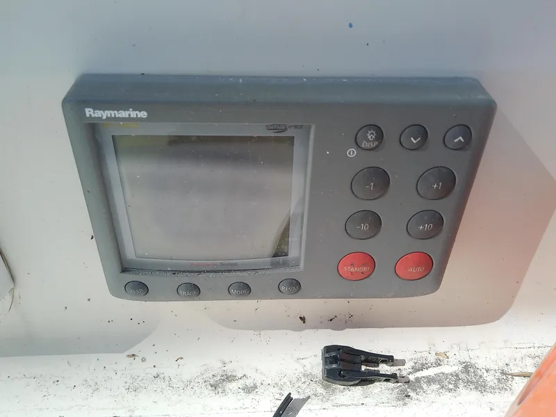 Slide: The Image of Raymarine control panel on 1990 Hunter Passage 42 sailboat, featuring navigation buttons and display. - 19