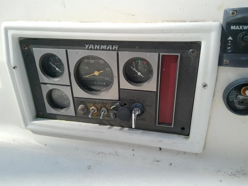 Slide: The Image of Control panel of a 1990 Hunter Passage 42 sailboat with Yanmar engine gauges. - 20