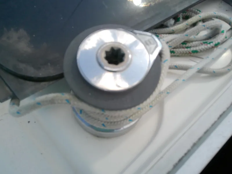 Slide: The Image of Winch on 1990 Hunter Passage 42 sailboat with rope wrapped around it. - 24