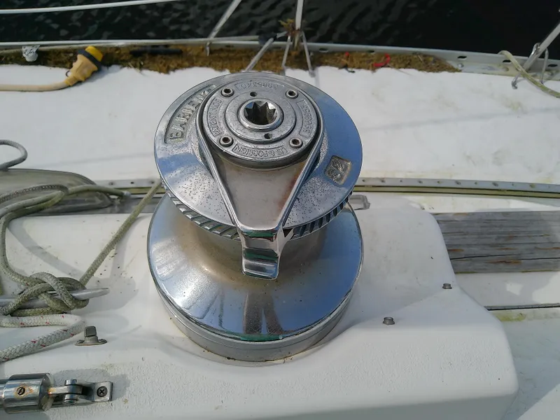 Slide: The Image of Winch on 1990 Hunter Passage 42 sailboat deck, with ropes and fittings. - 26