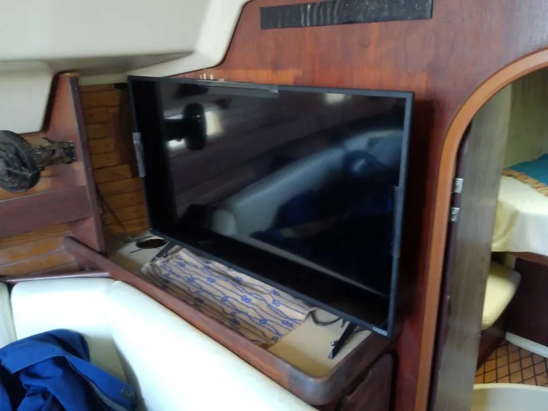 Slide: The Image of Flat-screen TV mounted inside 1990 Hunter Passage 42 yacht cabin. - 29