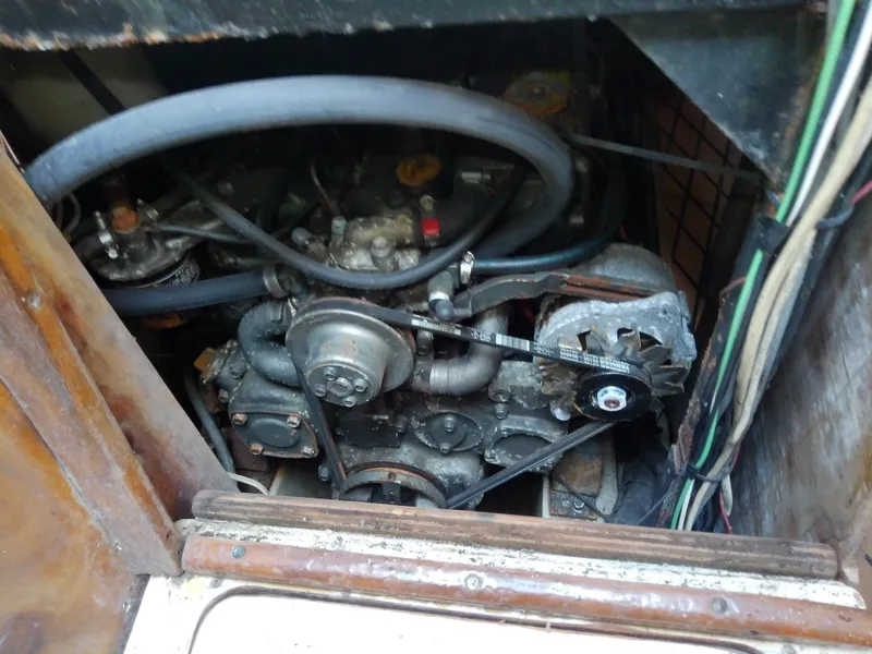 Slide: The Image of Engine compartment of a 1990 Hunter Passage 42 sailboat, showing belts and hoses. - 39