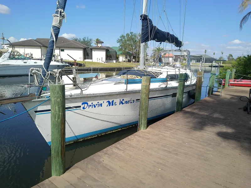 Slide: The Image of Sailboat "Drivin Me Knots" docked, Hunter Passage 42, 1990 model, sunny day. - 4