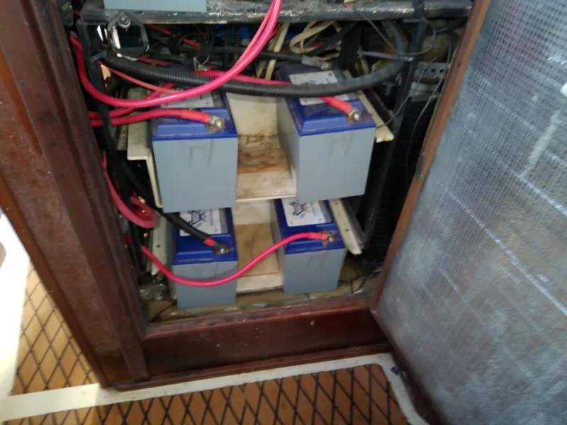 Slide: The Image of Battery compartment of a 1990 Hunter Passage 42 sailboat with wiring connections. - 47