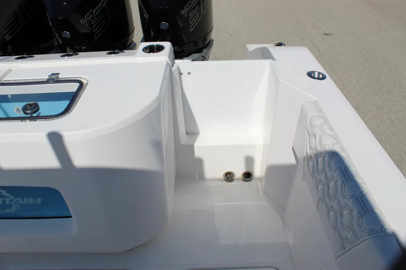 Slide: The Image of 2024 Fountain 32 NX boat interior with seating and engine area. - 31