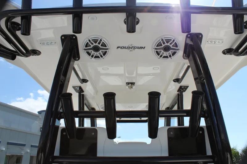 Slide: The Image of 2024 Fountain 32 NX boat with rod holders and speakers, viewed from below. - 40