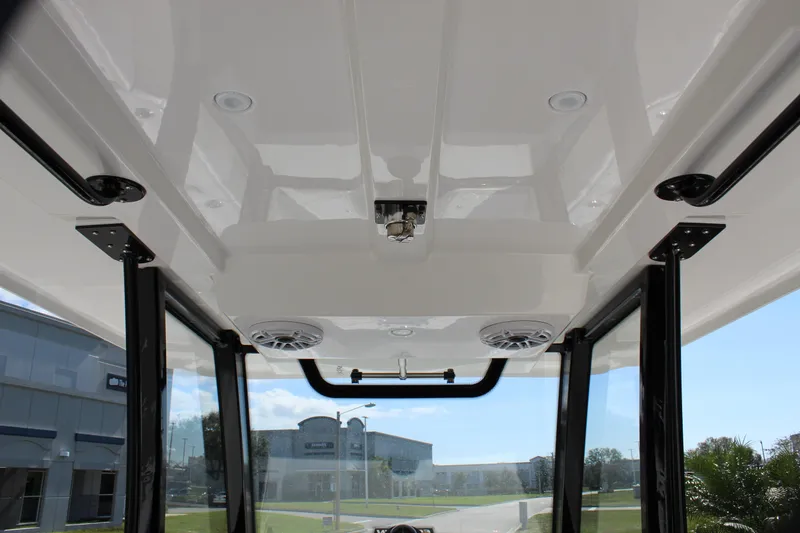 Slide: The Image of 2024 Fountain 32 NX boat interior roof with speakers and lighting. - 43