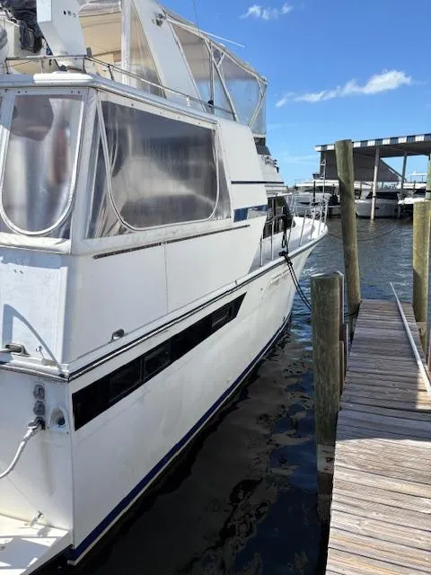 Slide: The Image of 1990 Californian 45 Motor Yacht docked at marina under clear blue sky. - 11