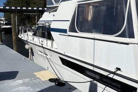 Slide: The Image of 1990 Californian 45 Motor Yacht docked at marina, side view. - 13