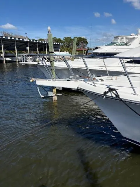 Slide: The Image of 1990 Californian 45 Motor Yacht docked at marina under clear blue sky. - 16