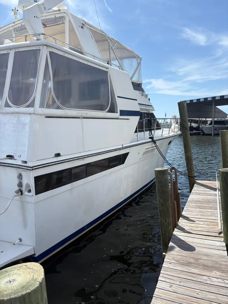 Slide: The Image of 1990 Californian 45 Motor Yacht docked at marina under clear blue sky. - 18