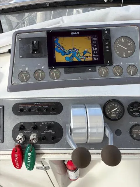 Slide: The Image of Control panel of a 1990 Californian 45 Motor Yacht with navigation display. - 21