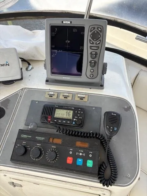 Slide: The Image of Control panel of a 1990 Californian 45 Motor Yacht with navigation and communication equipment. - 22