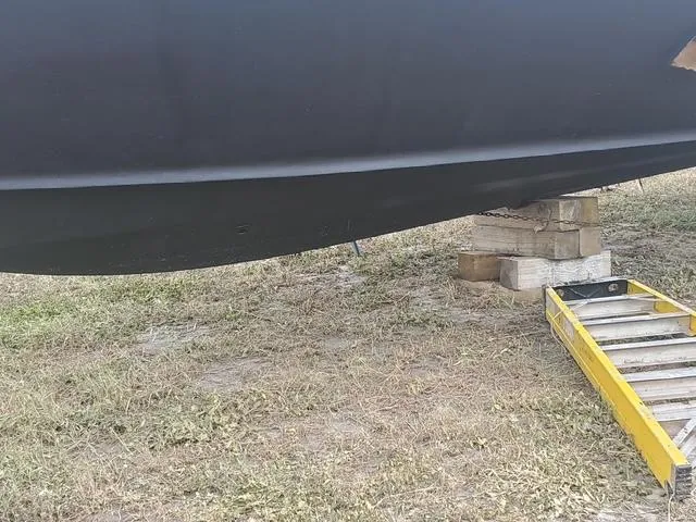 Slide: The Image of 1990 Californian 45 Motor Yacht hull on dry dock, supported by blocks and ladder. - 3