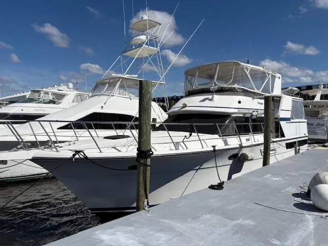 Slide: The Image of 1990 Californian 45 Motor Yacht docked at marina under clear blue sky. - 4