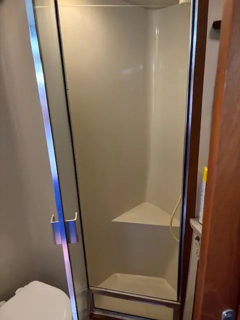 Slide: The Image of Shower area in a 1990 Californian 45 Motor Yacht bathroom. - 46