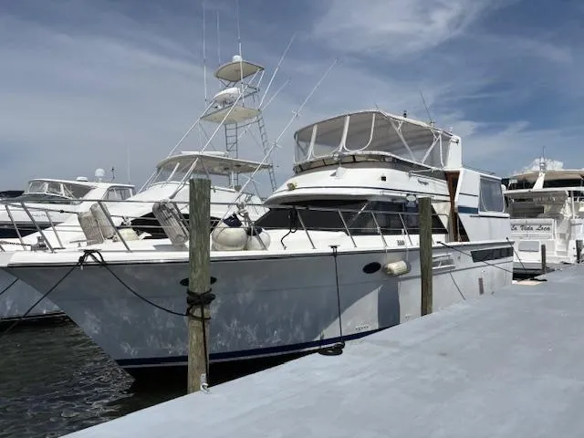 Slide: The Image of 1990 Californian 45 Motor Yacht docked at marina under clear sky. - 5