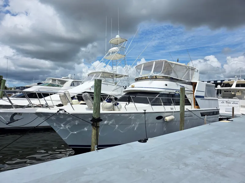 Slide: The Image of 1990 Californian 45 Motor Yacht docked at marina under cloudy sky. - 6