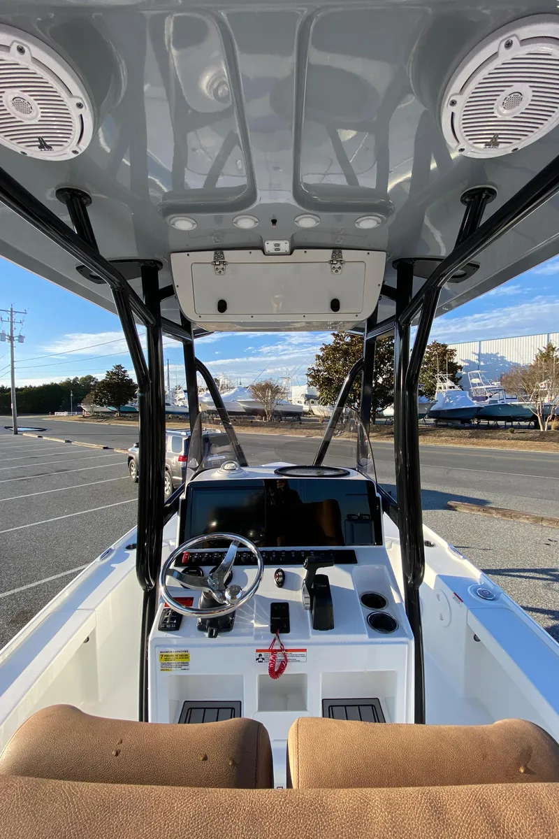 Slide: The Image of 2021 Sea Hunt BX 22 BR boat interior with steering console and seating. - 10