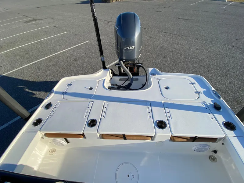 Slide: The Image of 2021 Sea Hunt BX 22 BR boat with Yamaha 200 engine in parking lot. - 16
