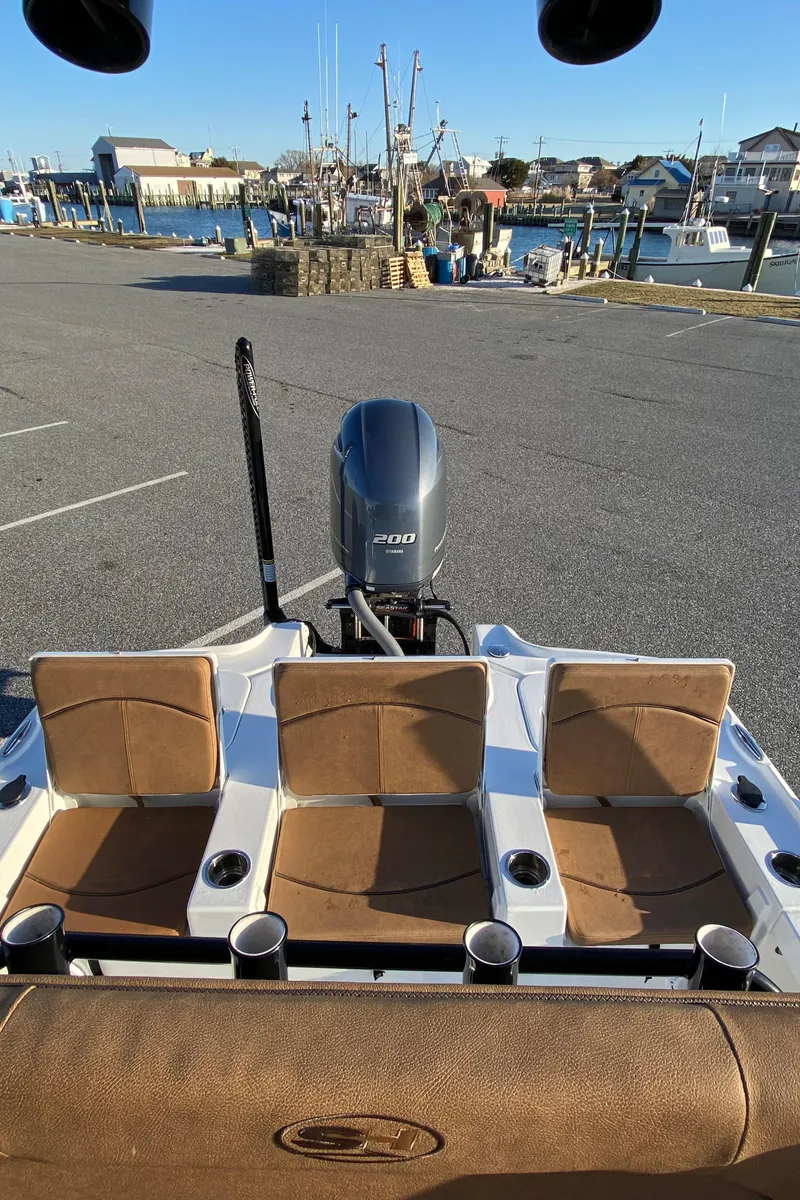 Slide: The Image of 2021 Sea Hunt BX 22 BR boat with Yamaha engine at a marina. - 17