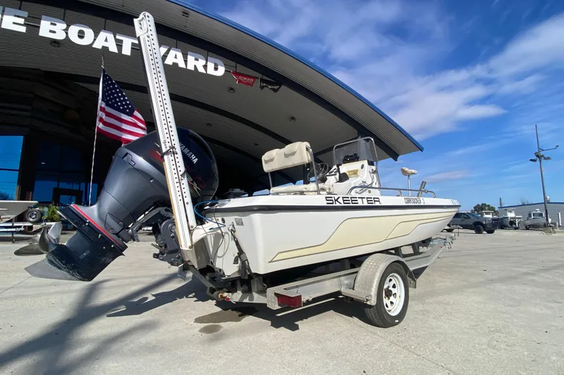 Slide: The Image of 2005 Skeeter ZX20 Bay boat console with steering wheel and controls. - 13