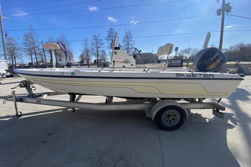 Slide: The Image of 2005 Skeeter ZX20 Bay boat interior with console and seating area. - 16