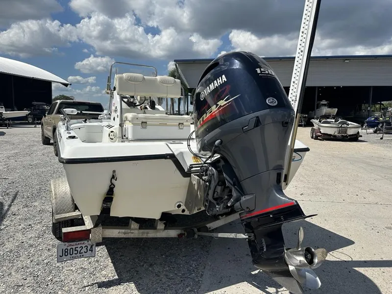 Slide: The Image of 2005 Skeeter ZX20 Bay boat on trailer outside dealership, featuring Yamaha outboard motor. - 3