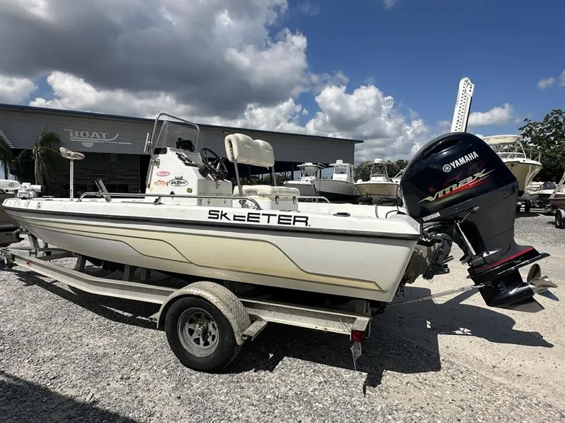 Slide: The Image of 2005 Skeeter ZX20 Bay boat with outboard motor, parked on a trailer. - 4