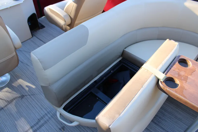 Slide: The Image of 2022 Veranda VR22F2 Luxury boat interior with beige seating and storage compartment. - 11