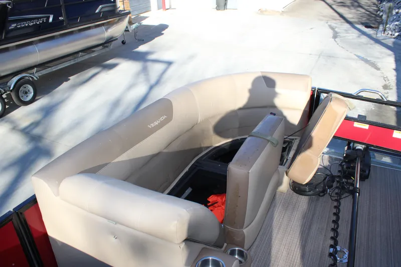 Slide: The Image of 2022 Veranda VR22F2 Luxury pontoon boat with beige seating and storage compartment. - 4