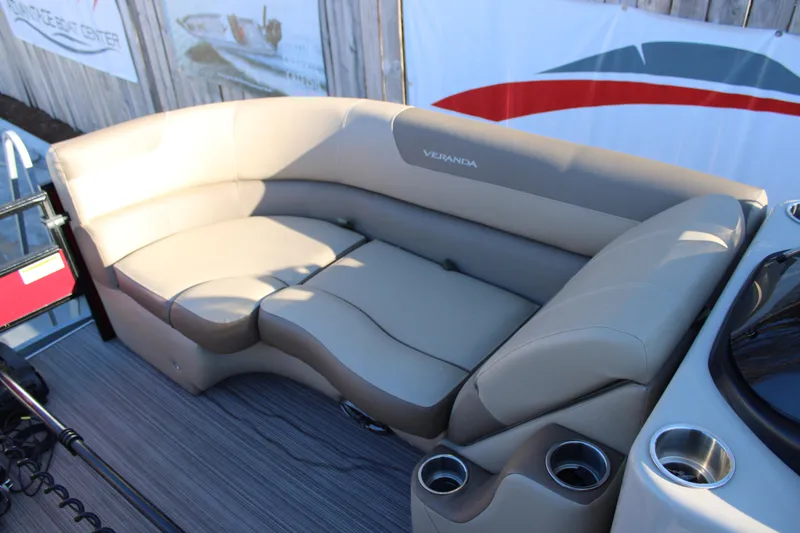 Slide: The Image of 2022 Veranda VR22F2 Luxury boat interior with beige seating and cup holders. - 6