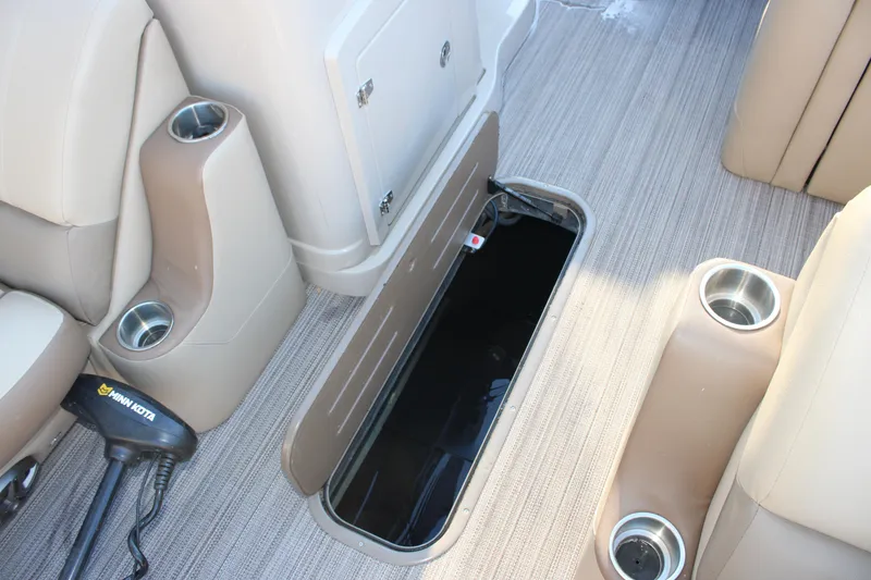Slide: The Image of 2022 Veranda VR22F2 Luxury boat interior with open storage compartment and cup holders. - 7