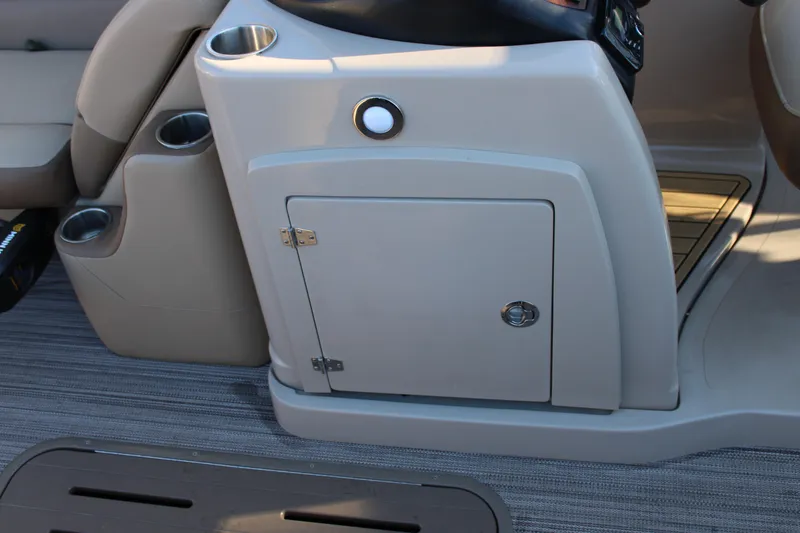Slide: The Image of 2022 Veranda VR22F2 Luxury boat interior console with storage compartment and cup holders. - 8