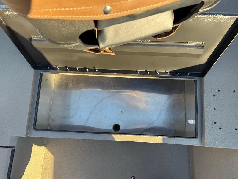 Slide: The Image of 2025 Excel 1651 River Warrior boat storage compartment, open and empty. - 13